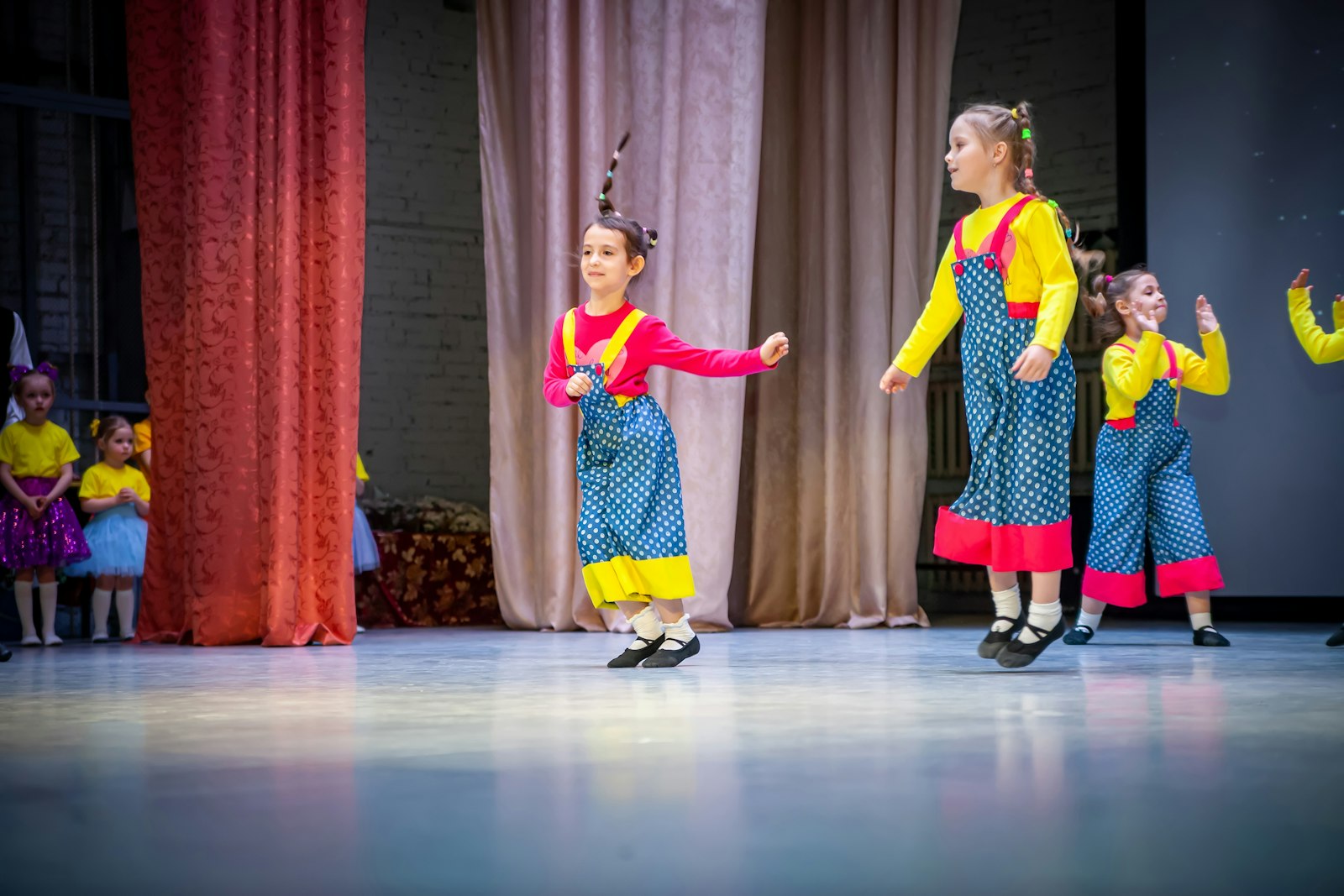 Children performing on stage at a Kaleidoscope Arts Studio showcase